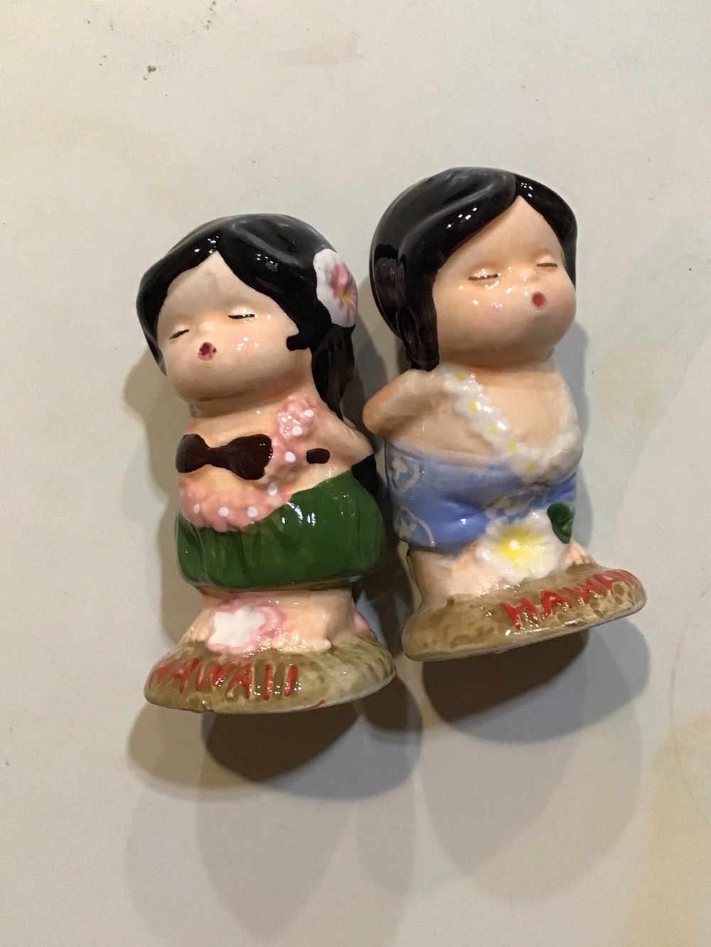 Hawaii Salt & Pepper Shakers - boy and girl leaning in for kiss. New